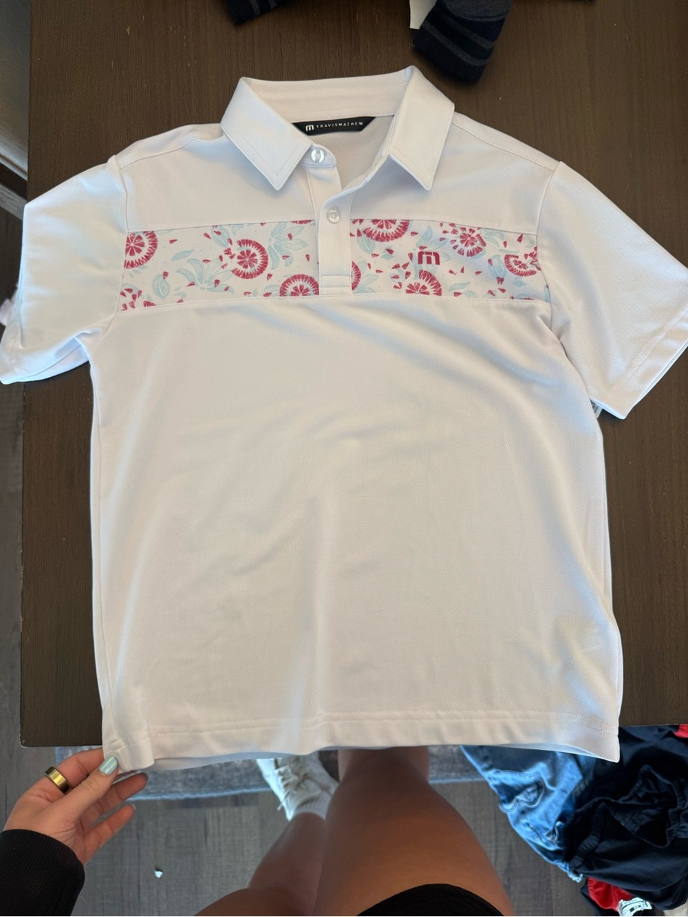 Travis Mathew White Polo with Pink Floral Chest Band